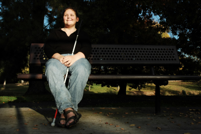 Woman enjoys the afternoon sun in a park 